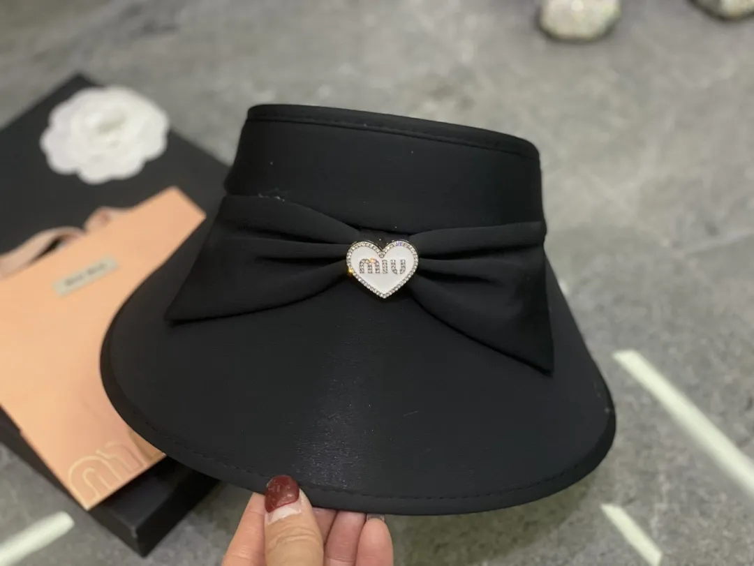 Miumiu 蝴蝶结冰丝空顶帽