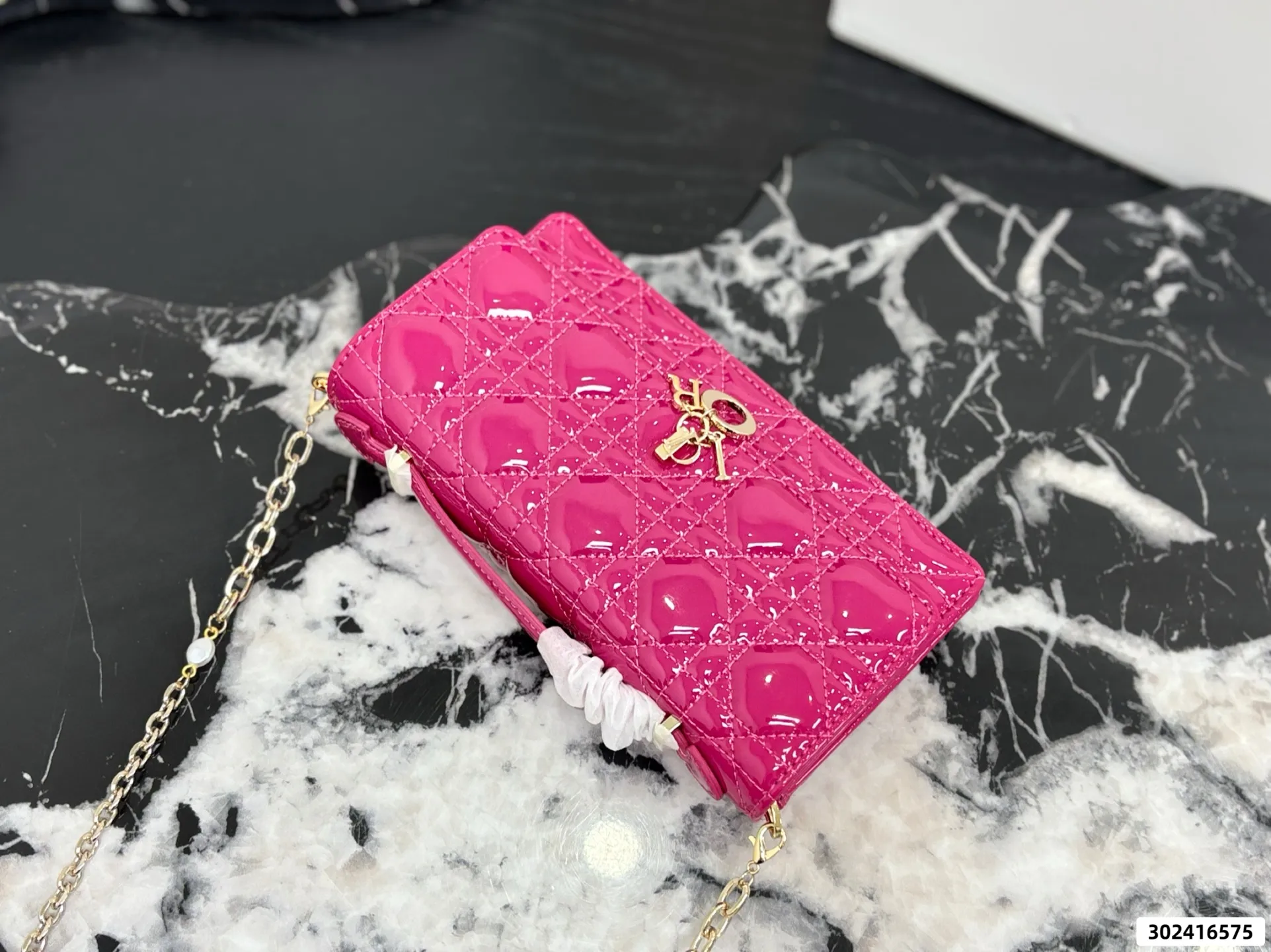 Collection of Lady Dior pouches in colorful patent leather with gold charms and luxury packaging - xiashuluxe