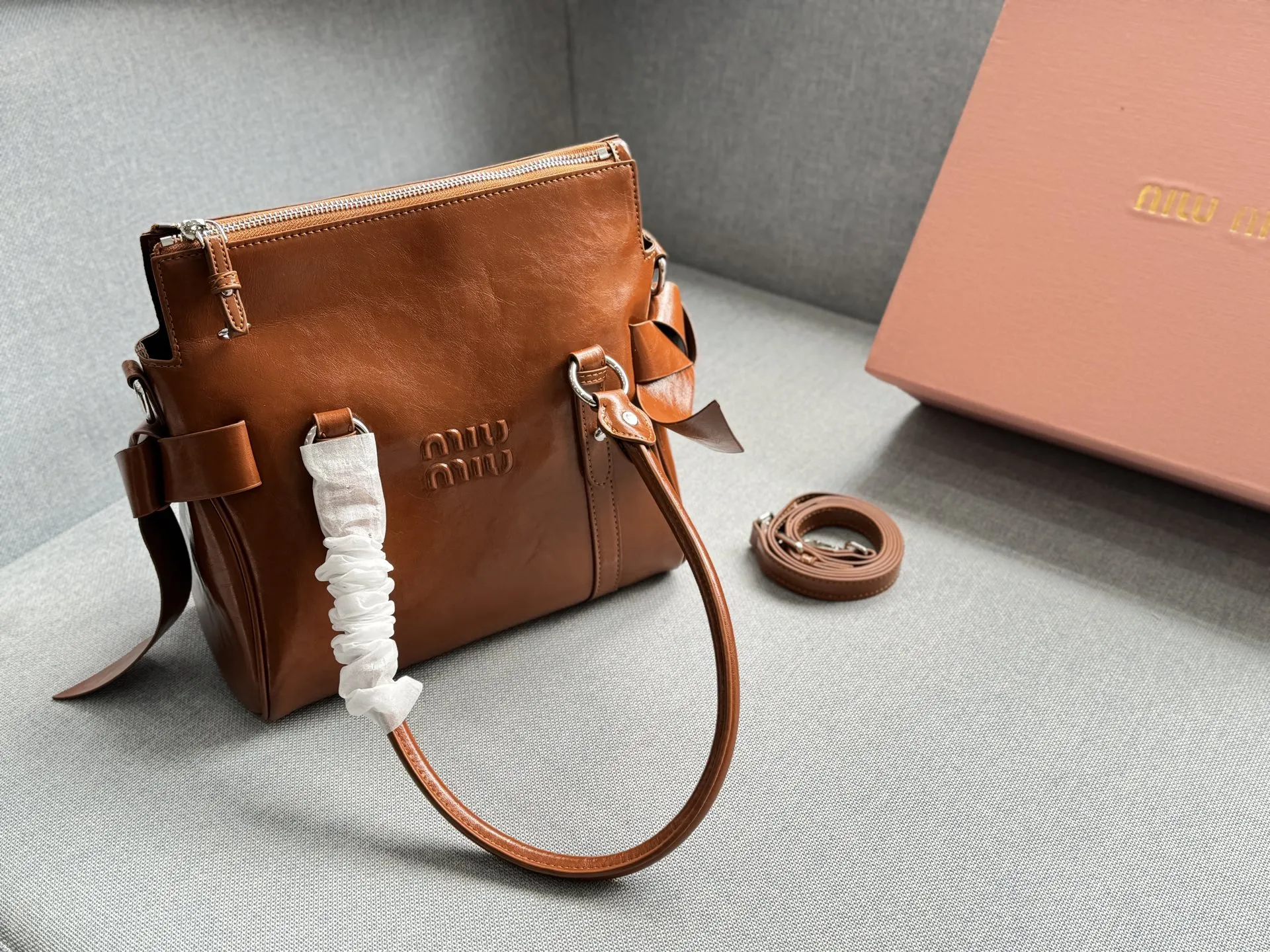 Collection of Miu Miu waxed leather shoulder bags with bow decorations in multiple colors (Black, Brown, Grey, Beige) - Size 26 - xiashuluxe