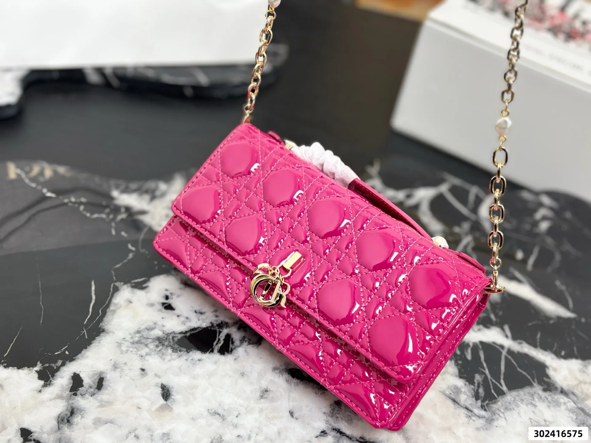 Collection of Lady Dior pouches in colorful patent leather with gold charms and luxury packaging - xiashuluxe