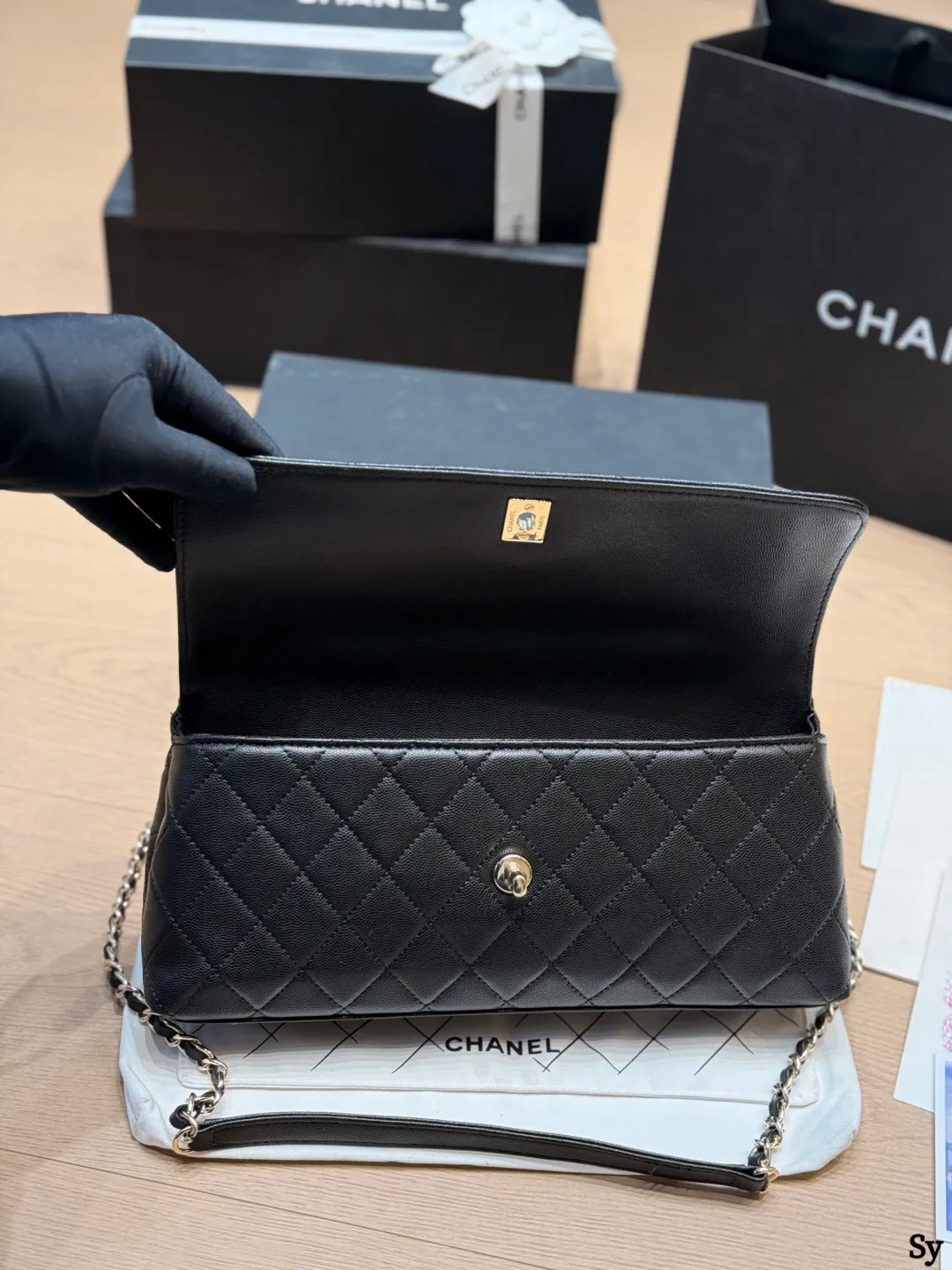 Chanel black caviar leather mini Kelly bag with top handle and gold hardware - xiashuluxe