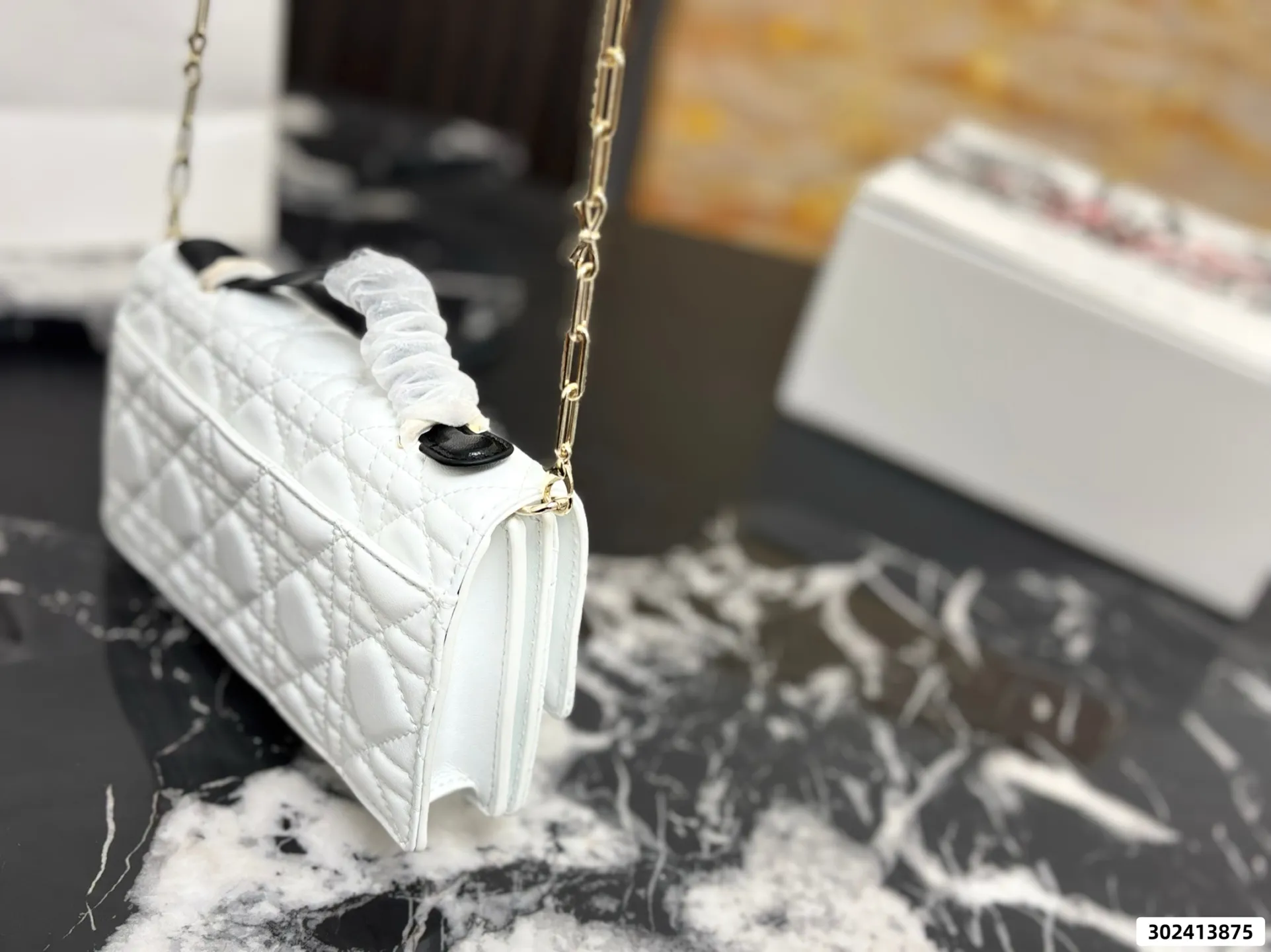 Collection of Lady Dior pouches in various colors including black, pink, and beige with luxury packaging - xiashuluxe