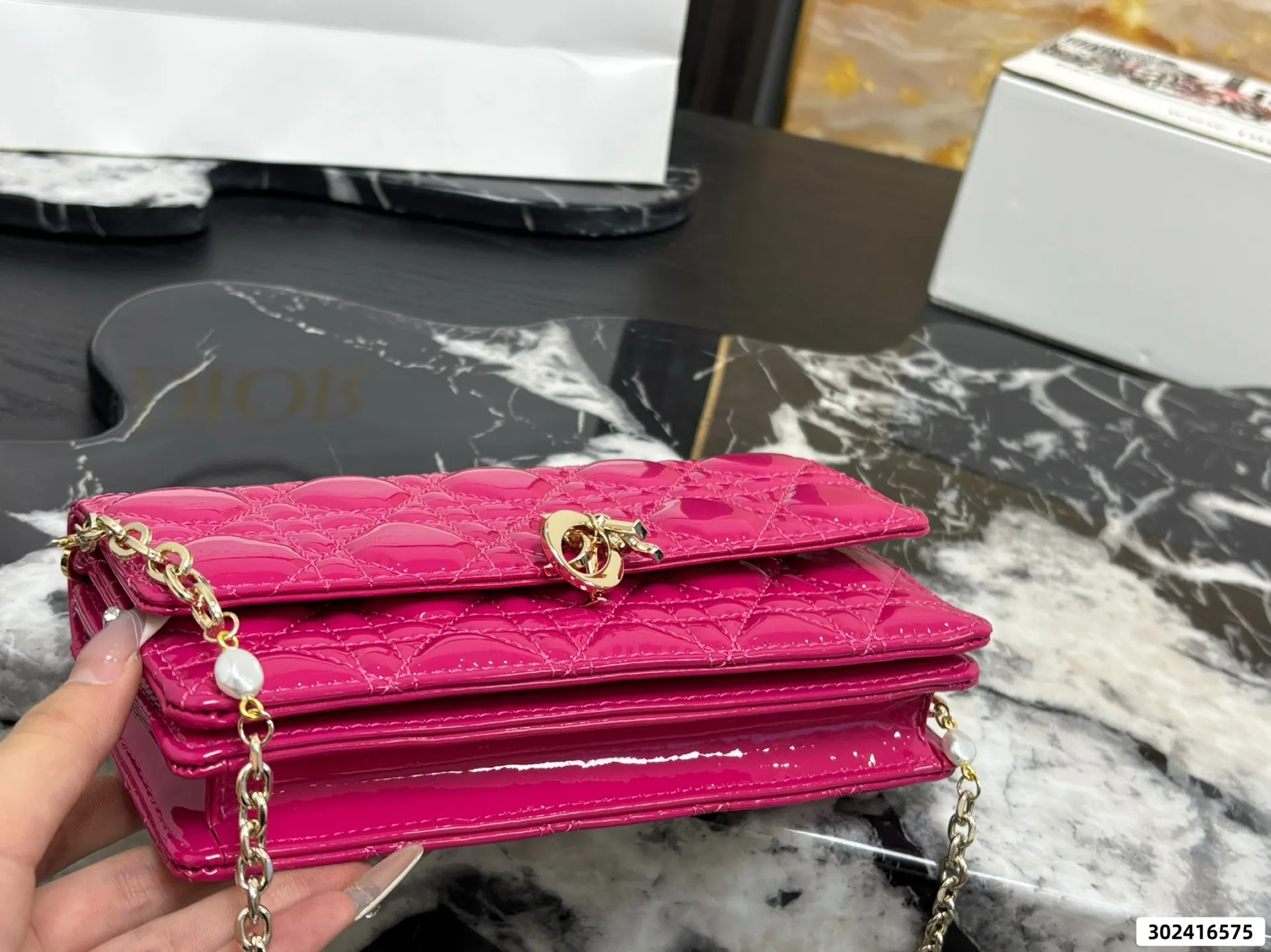 Collection of Lady Dior pouches in colorful patent leather with gold charms and luxury packaging - xiashuluxe