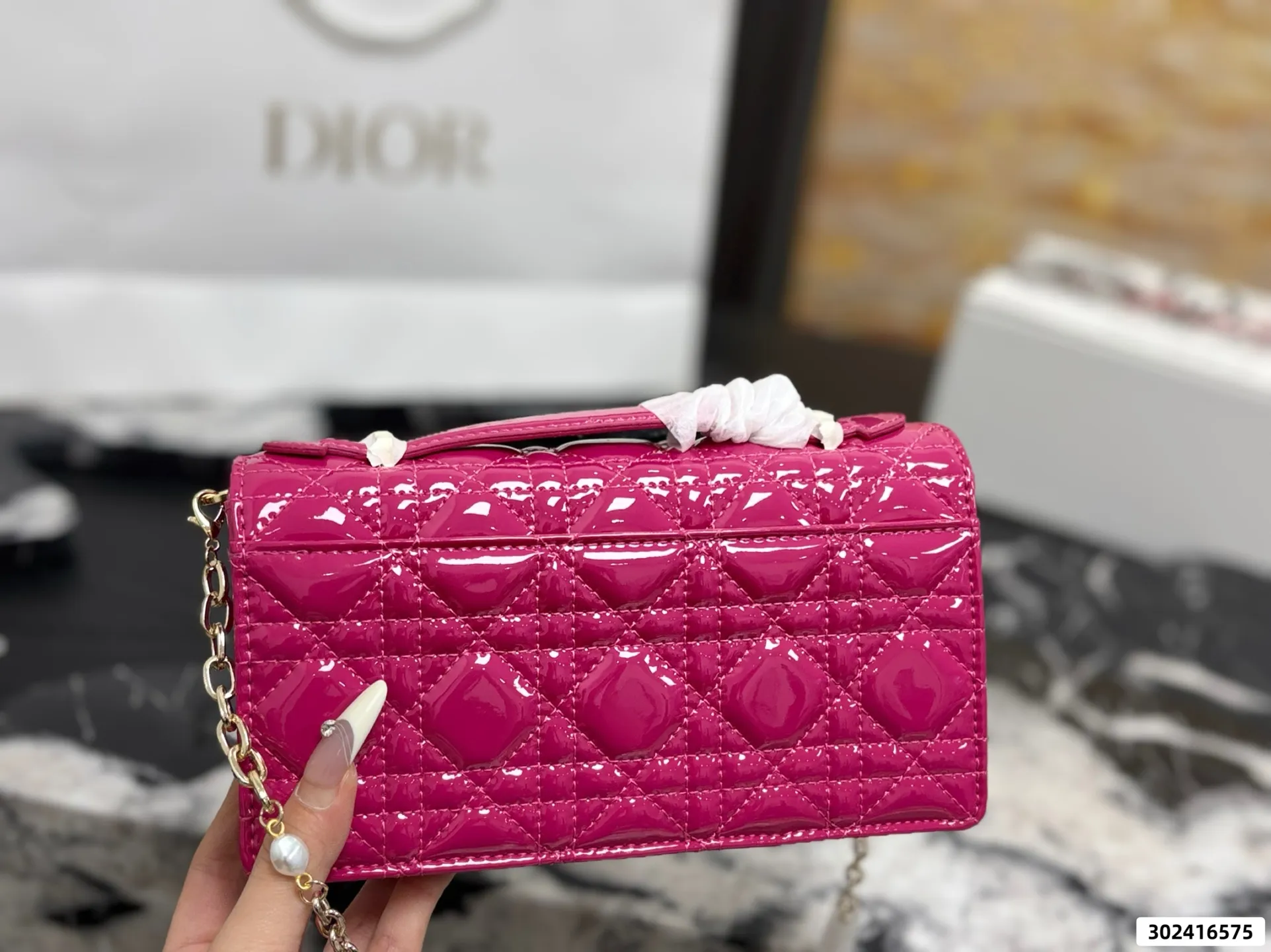 Collection of Lady Dior pouches in colorful patent leather with gold charms and luxury packaging - xiashuluxe