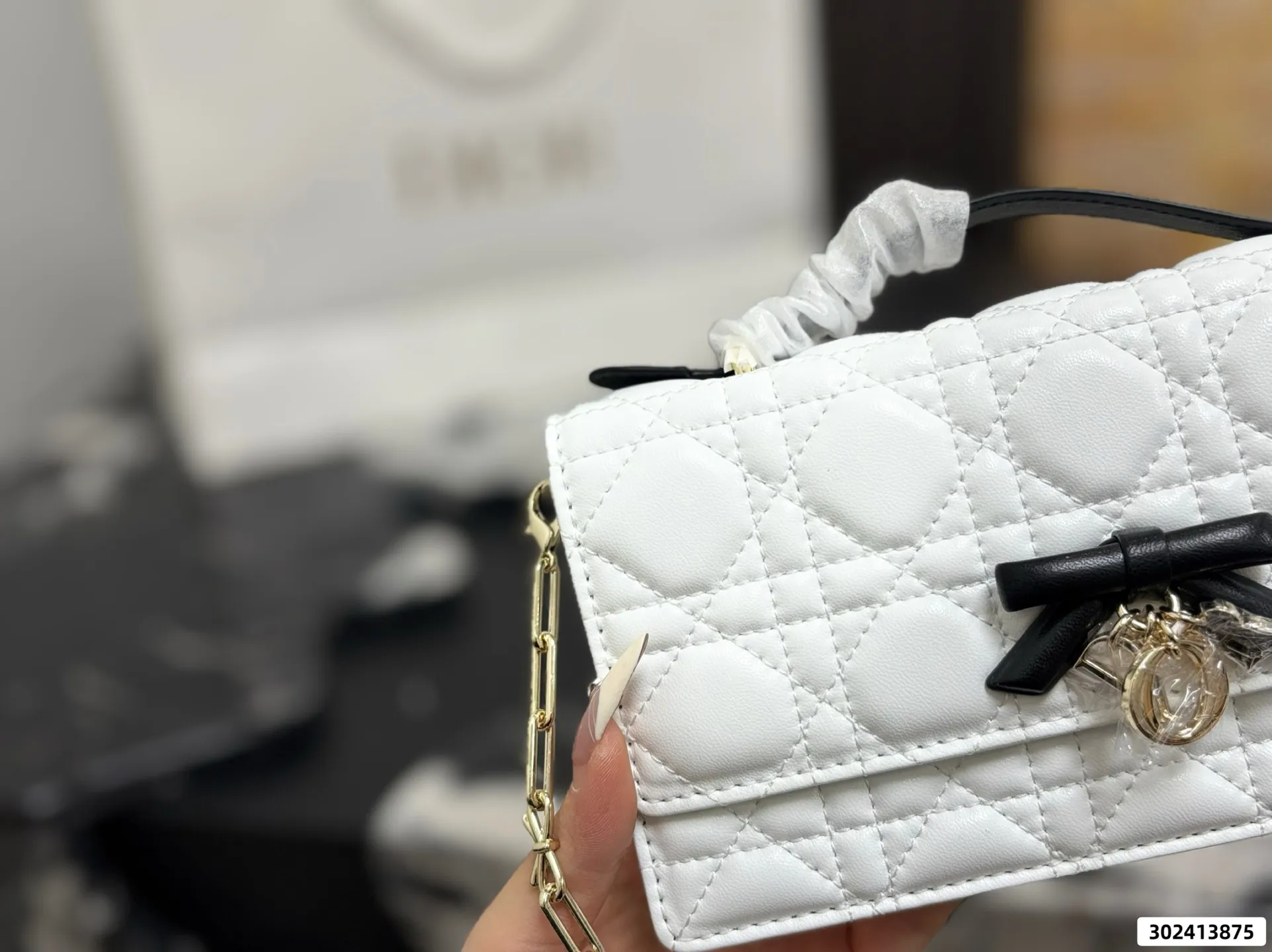 Collection of Lady Dior pouches in various colors including black, pink, and beige with luxury packaging - xiashuluxe