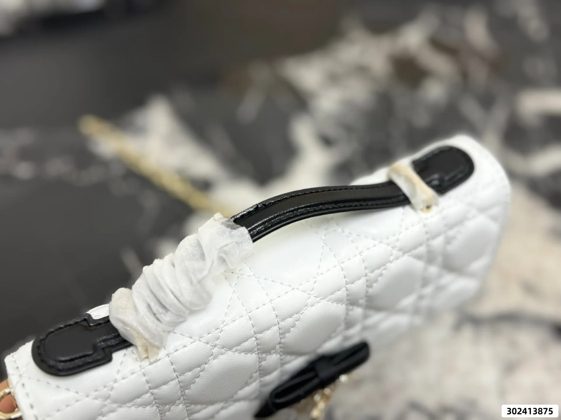 Collection of Lady Dior pouches in various colors including black, pink, and beige with luxury packaging - xiashuluxe