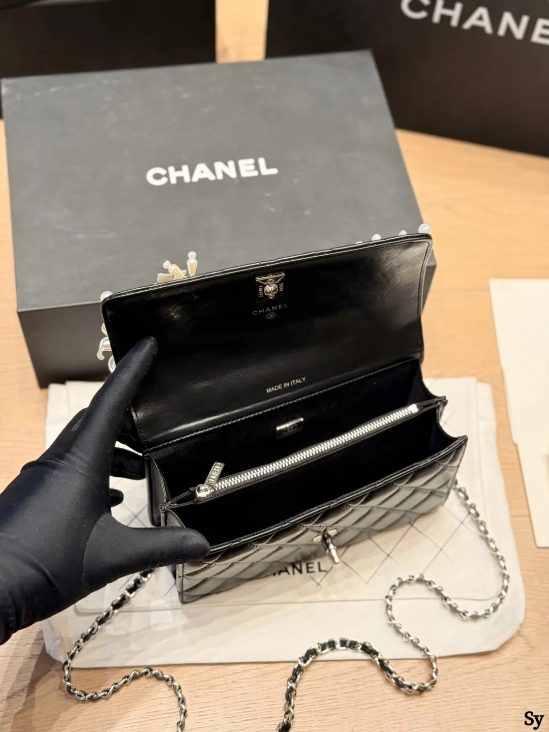 Chanel black quilted leather flap bag with 3D camellia flowers and pearl handle - xiashuluxe