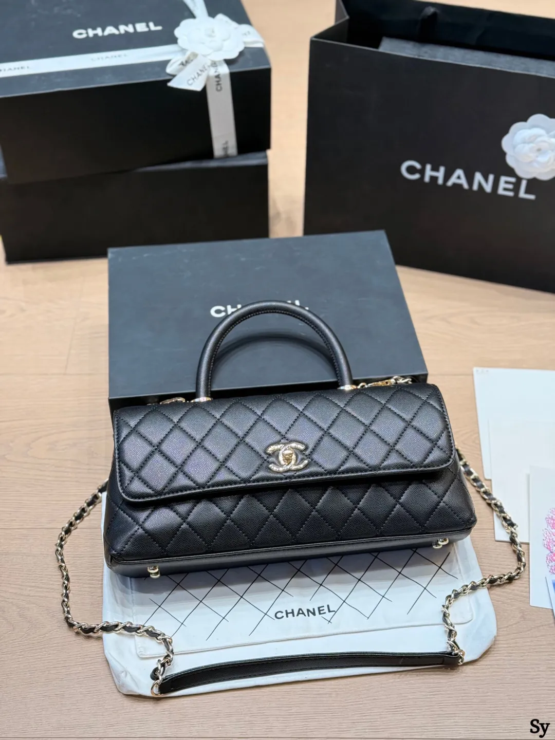 Chanel black caviar leather mini Kelly bag with top handle and gold hardware - xiashuluxe