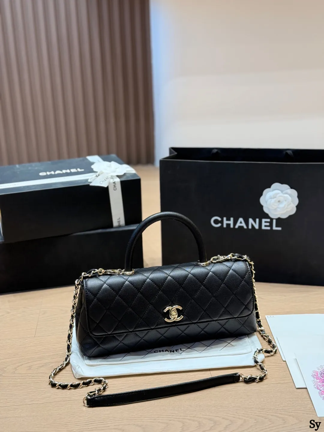 Chanel black caviar leather mini Kelly bag with top handle and gold hardware - xiashuluxe