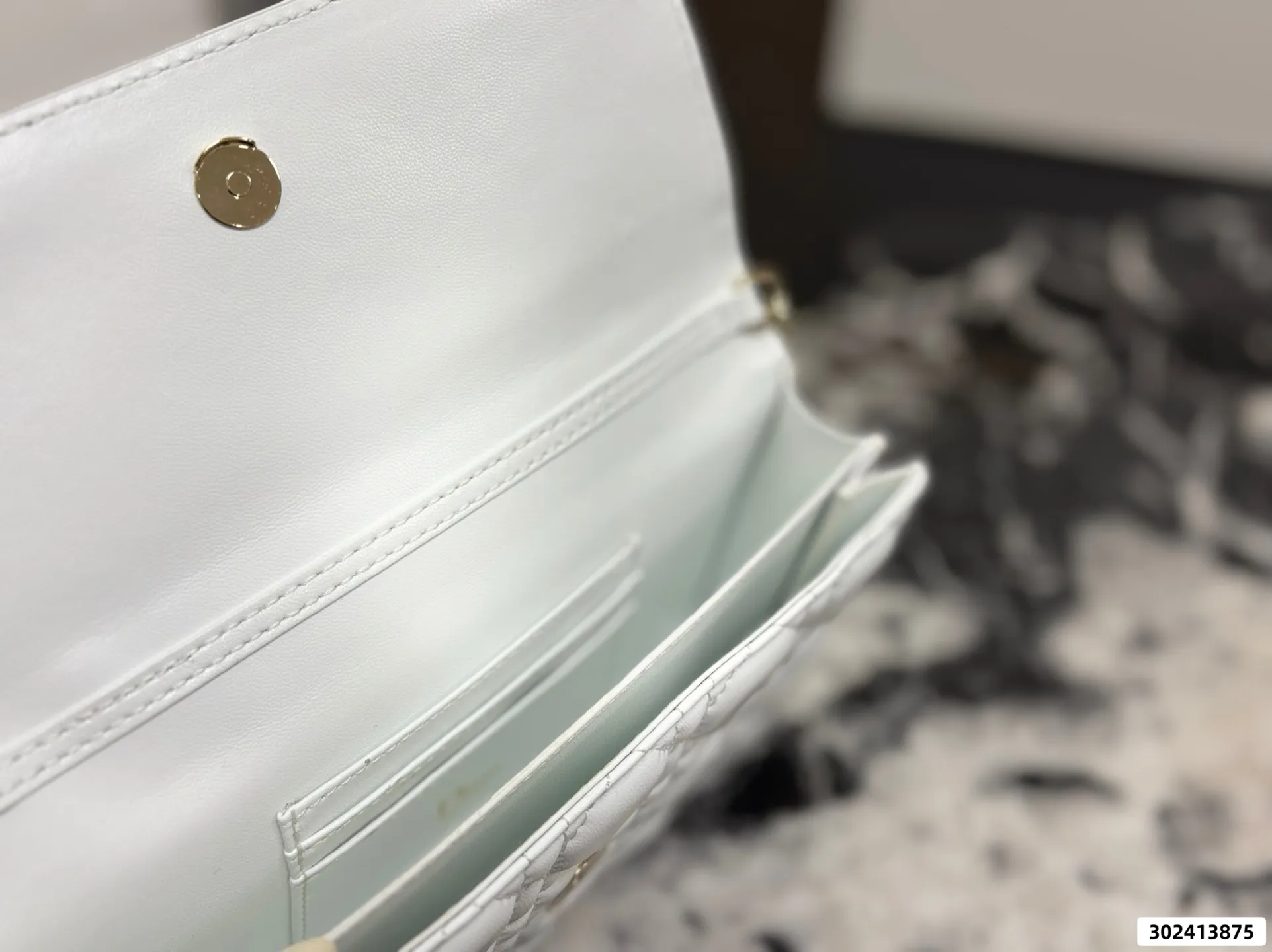 Collection of Lady Dior pouches in various colors including black, pink, and beige with luxury packaging - xiashuluxe