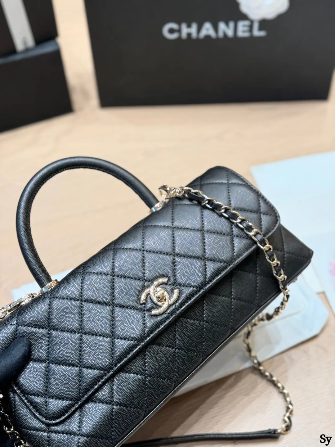 Chanel black caviar leather mini Kelly bag with top handle and gold hardware - xiashuluxe