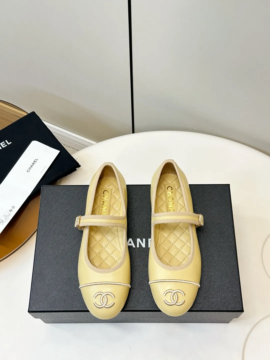 Chanel 1:1 premium Mary Jane flats in multiple colors (Black, White, Pink, Gold) with luxury packaging - xiashuluxe