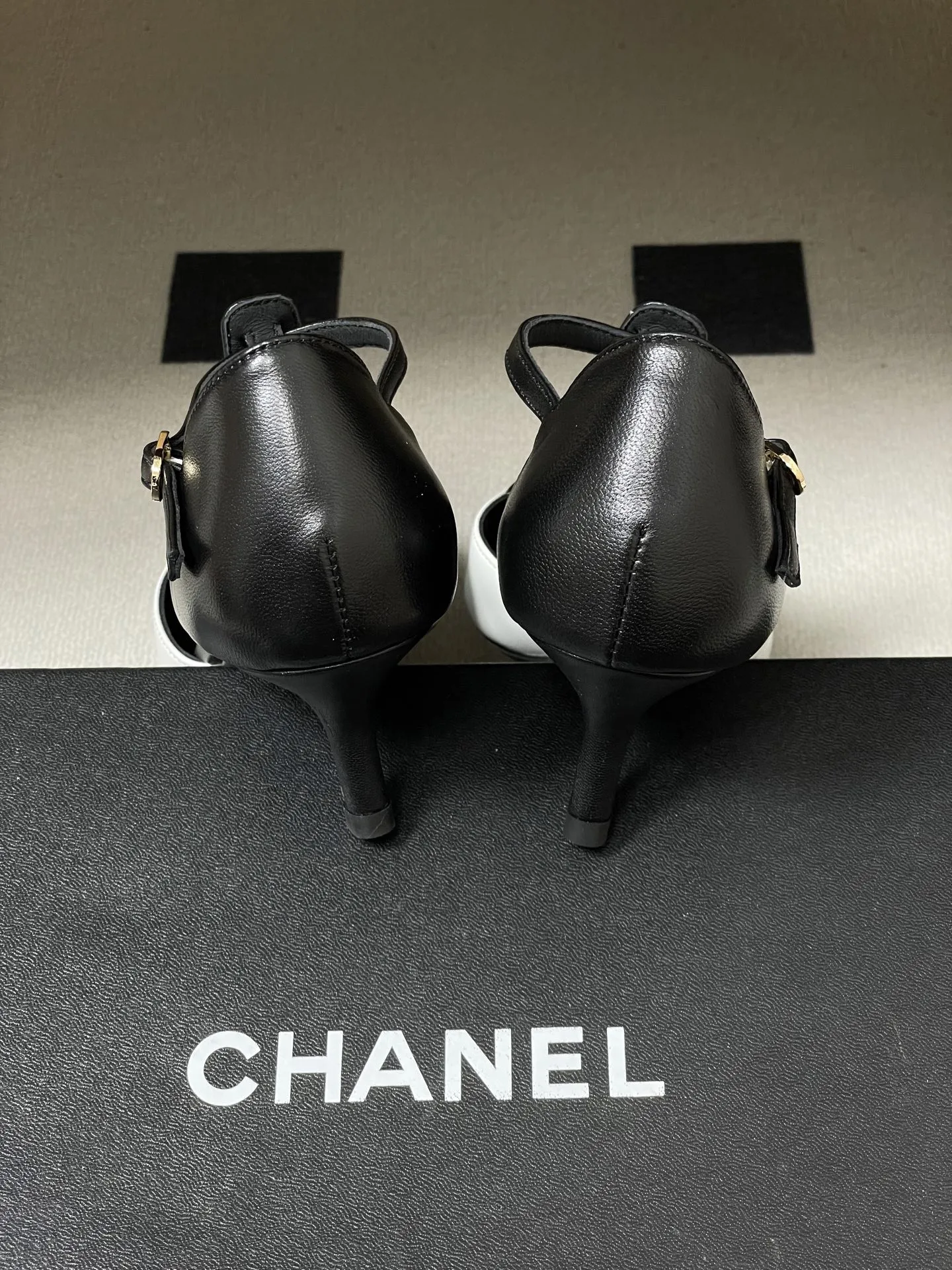 Chanel 1:1 premium apricot and black cap-toe T-strap kitten heels on luxury shoe box - xiashu