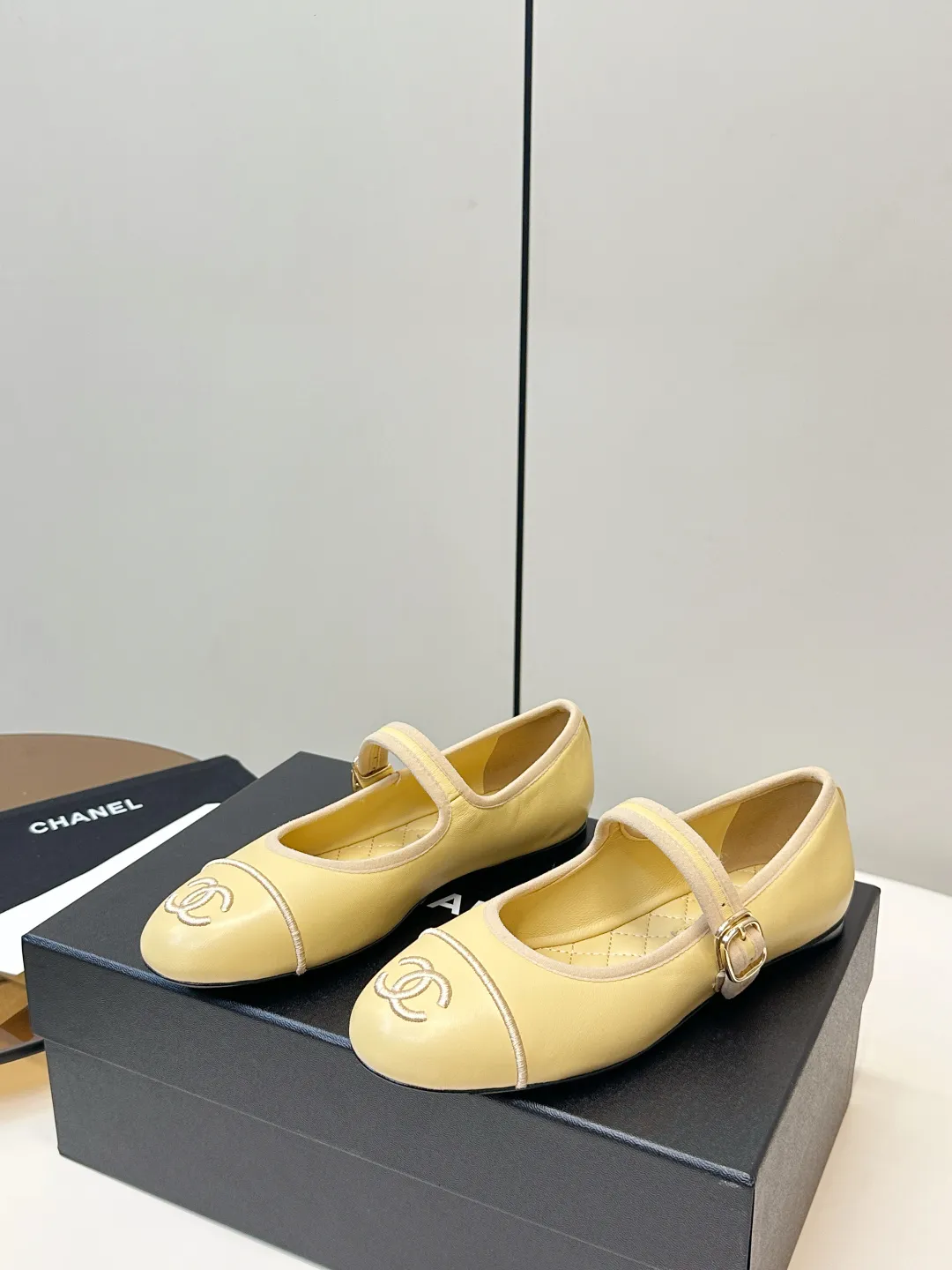 Chanel 1:1 premium Mary Jane flats in multiple colors (Black, White, Pink, Gold) with luxury packaging - xiashuluxe