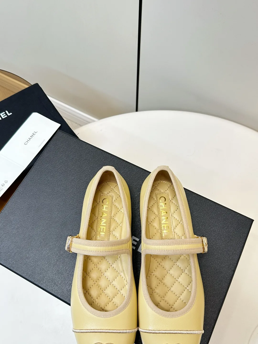 Chanel 1:1 premium Mary Jane flats in multiple colors (Black, White, Pink, Gold) with luxury packaging - xiashuluxe