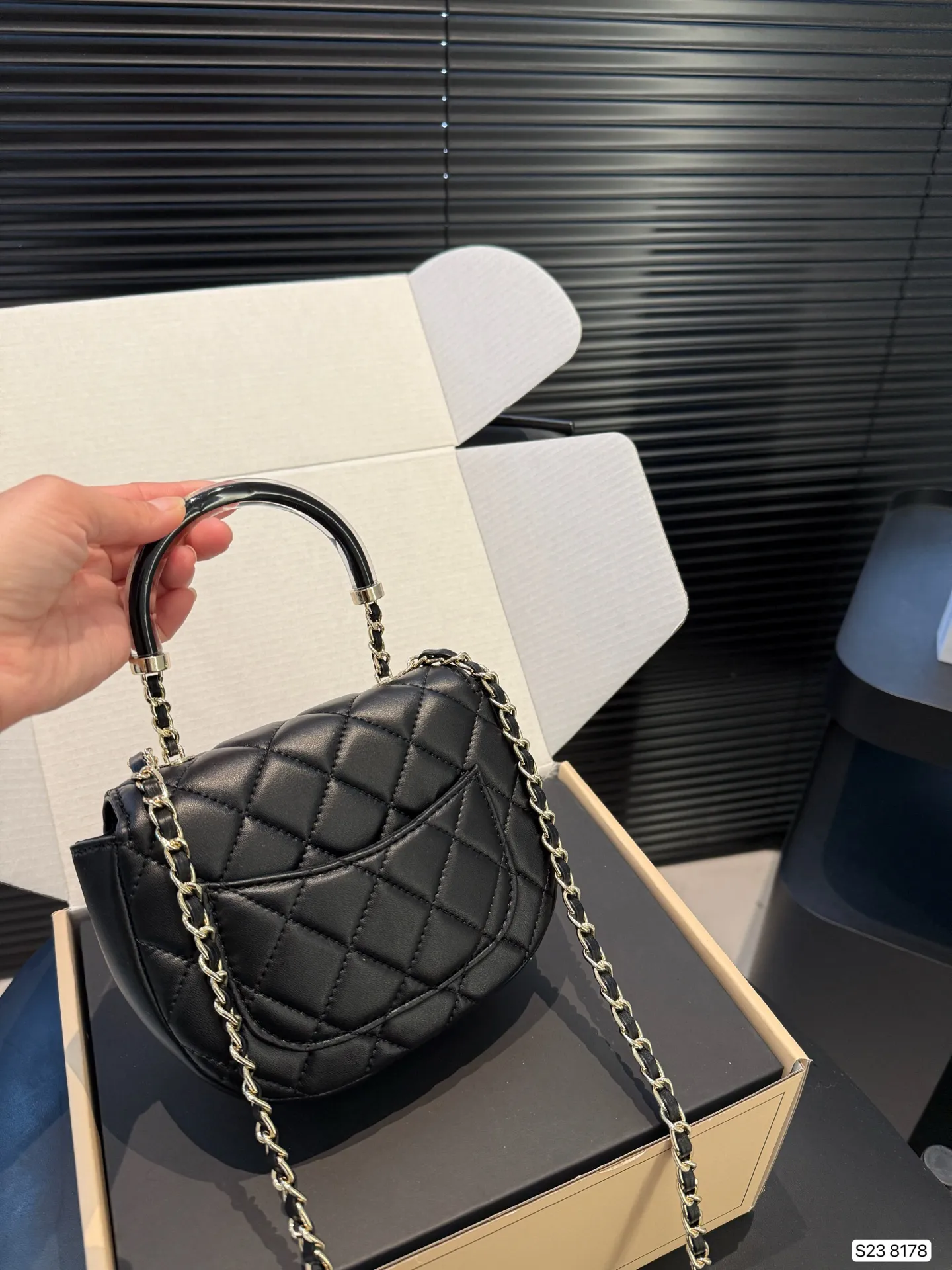 Chanel 1:1 premium 22 mini handbag in shiny black calfskin with gold hardware and CC medallion on luxury boutique box - xiashuluxe