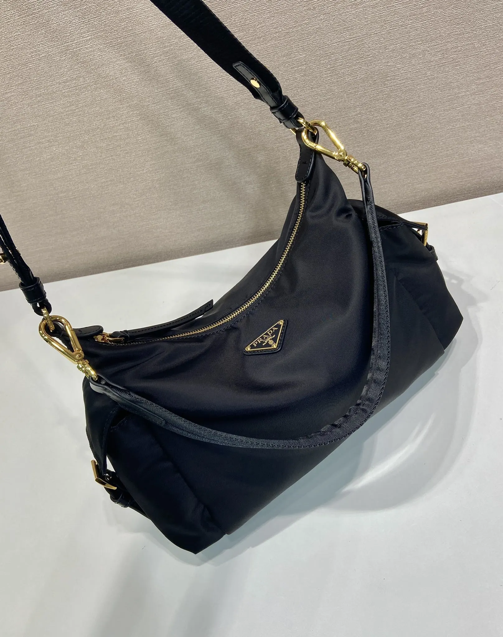 Prada 1:1 premium nylon hobo bag in black with triangle logo and detachable multi-way straps - xiashuluxe