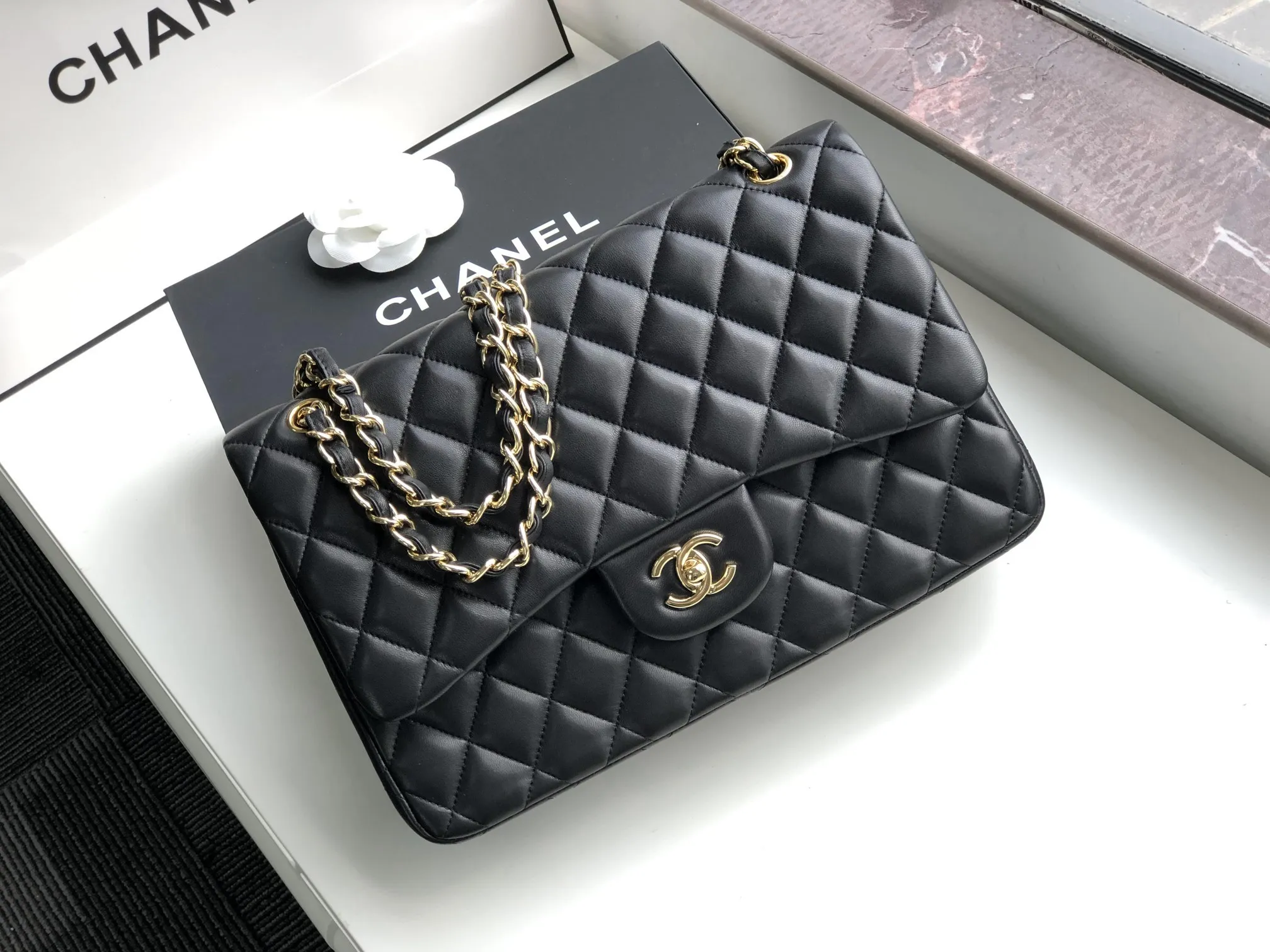 Chanel 1:1 premium Classic Flap bag in black lambskin with gold-tone hardware and signature diamond quilting on Chanel box - xiashuluxe