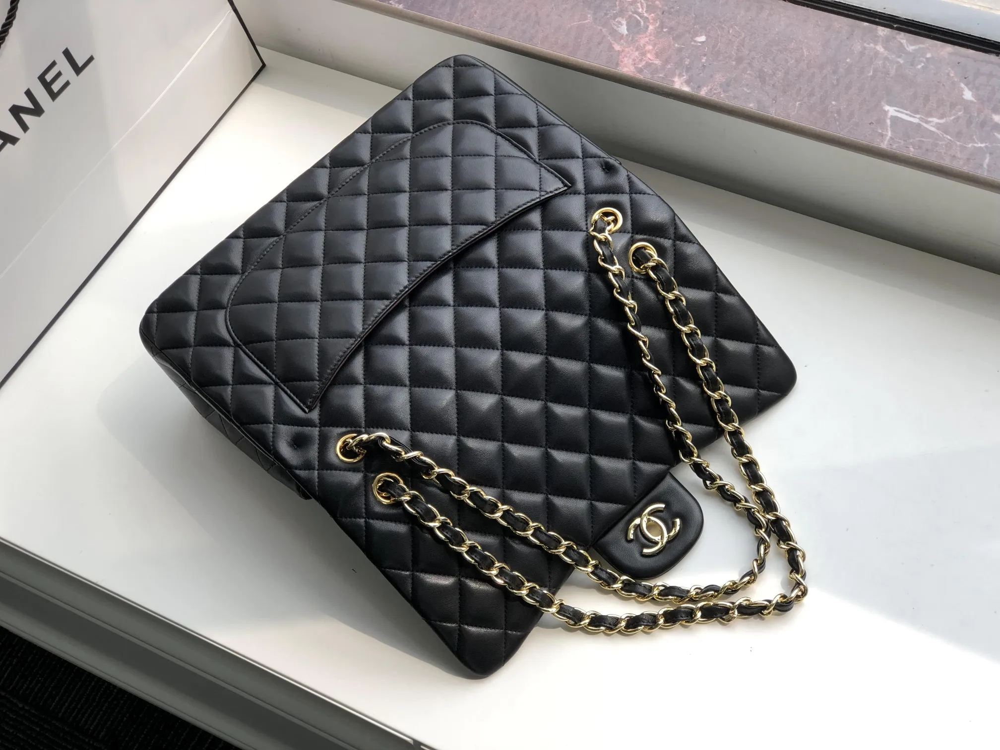 Chanel 1:1 premium Classic Flap bag in black lambskin with gold-tone hardware and signature diamond quilting on Chanel box - xiashuluxe