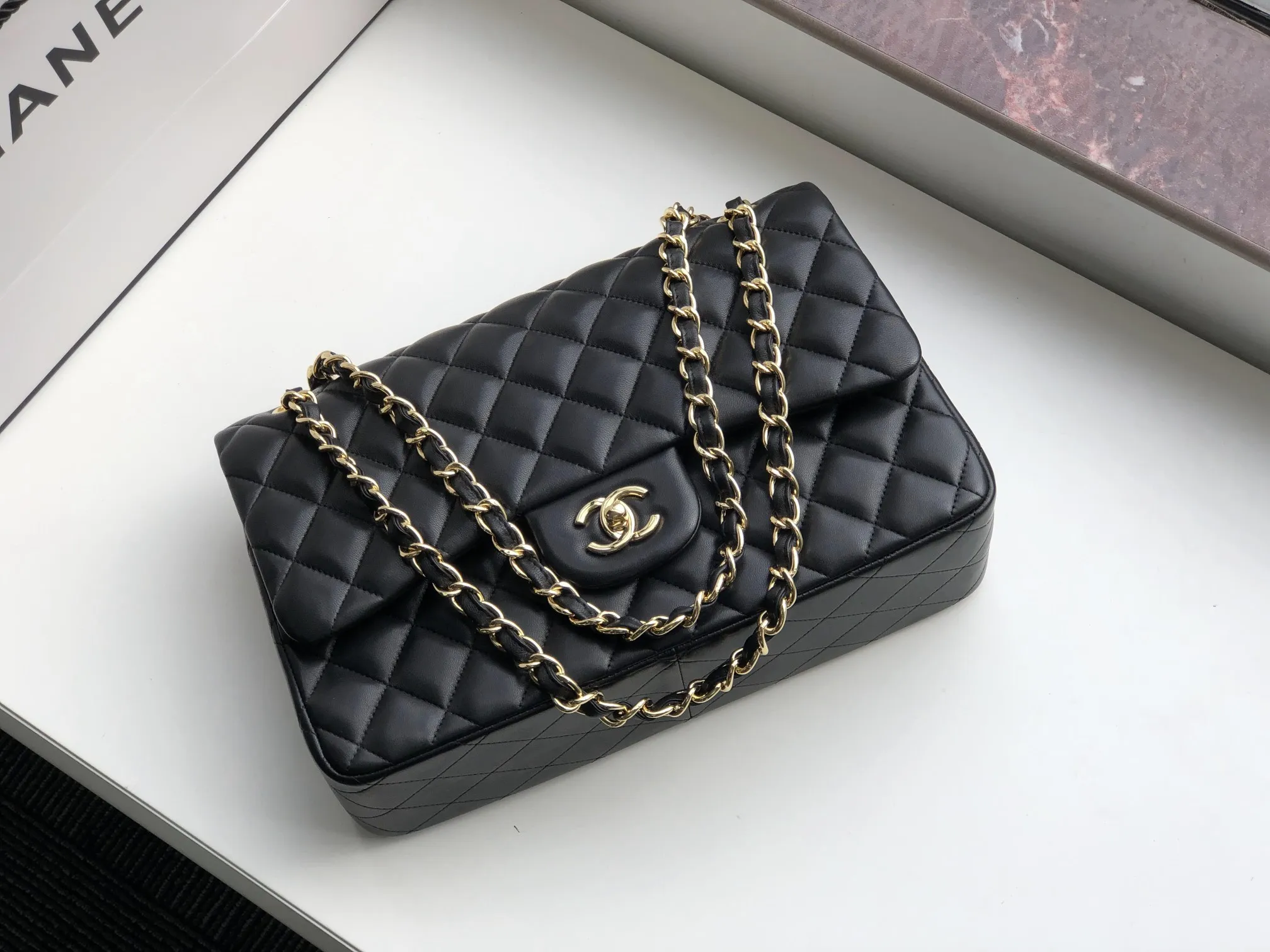 Chanel 1:1 premium Classic Flap bag in black lambskin with gold-tone hardware and signature diamond quilting on Chanel box - xiashuluxe