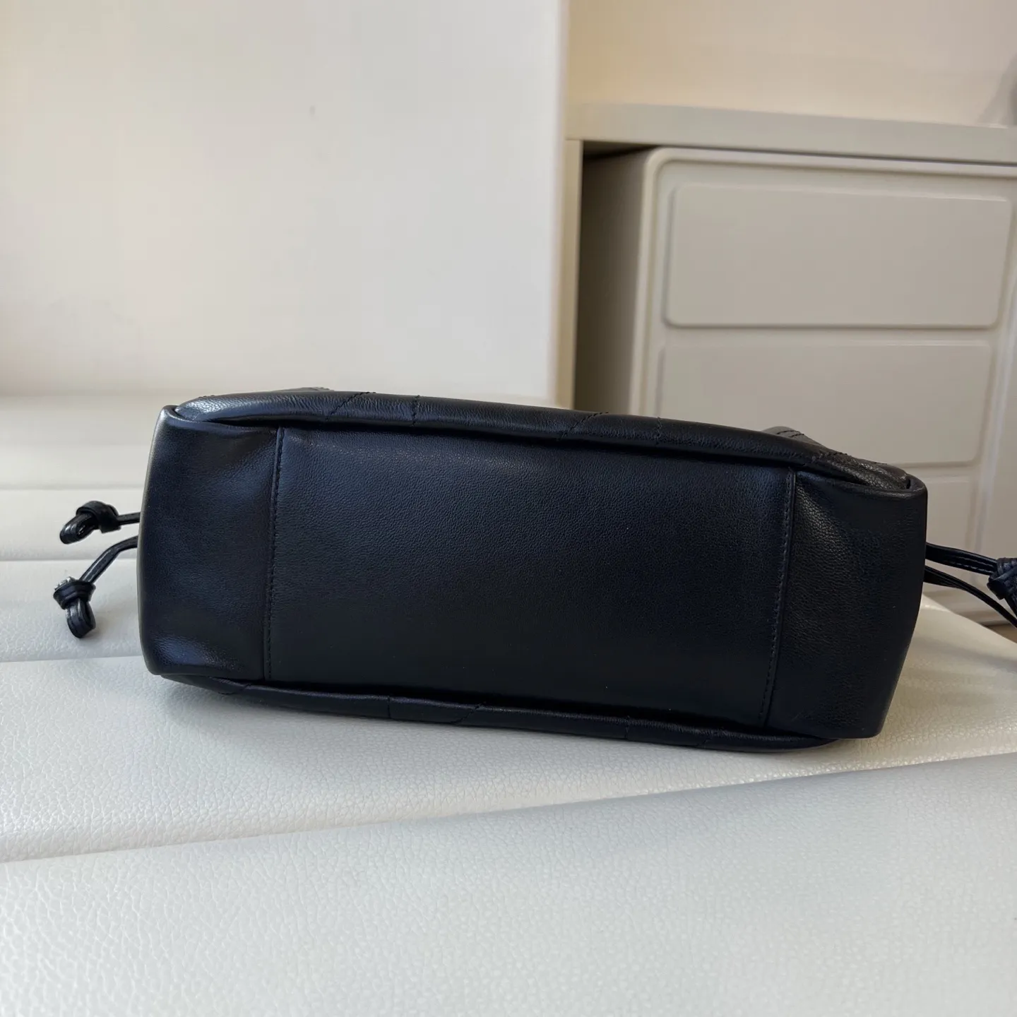 YSL 1:1 premium June Hobo bag in black quilted lambskin featuring gold-tone pivoting monogram closure and chain shoulder strap - xiashuluxe