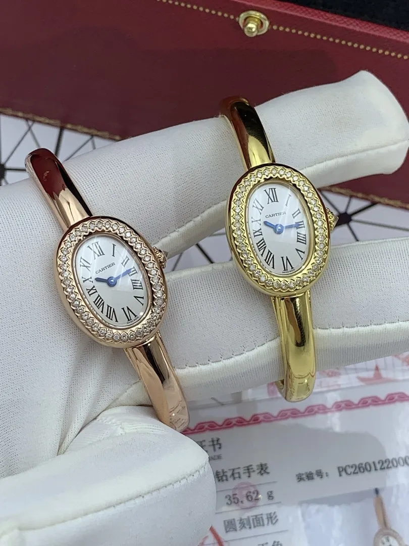 Cartier 1:1 premium Baignoire bangle watch in 18K rose gold and yellow gold with diamond-set oval bezel on display - xiashuluxe