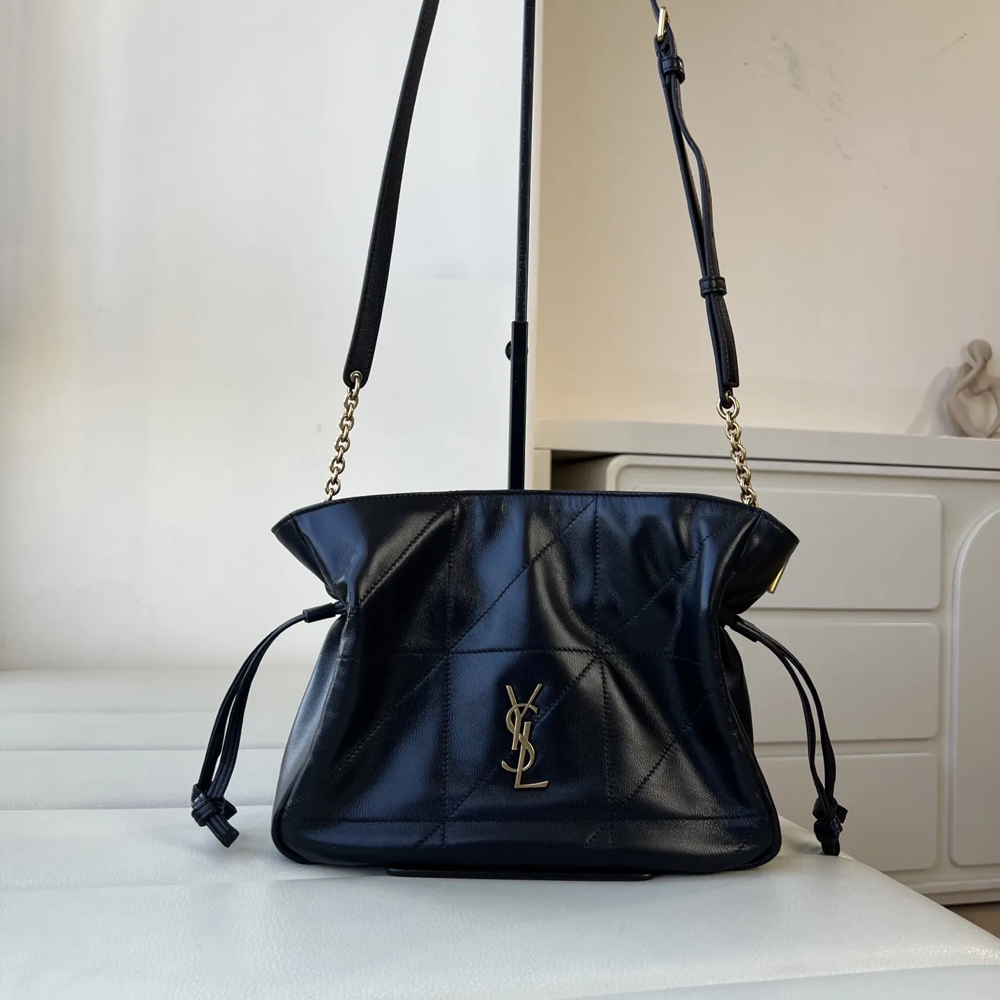 YSL 1:1 premium June Hobo bag in black quilted lambskin featuring gold-tone pivoting monogram closure and chain shoulder strap - xiashuluxe