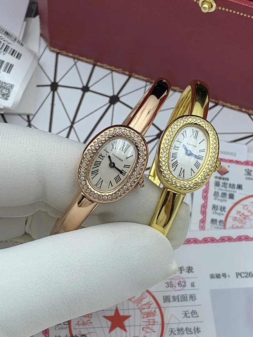 Cartier 1:1 premium Baignoire bangle watch in 18K rose gold and yellow gold with diamond-set oval bezel on display - xiashuluxe