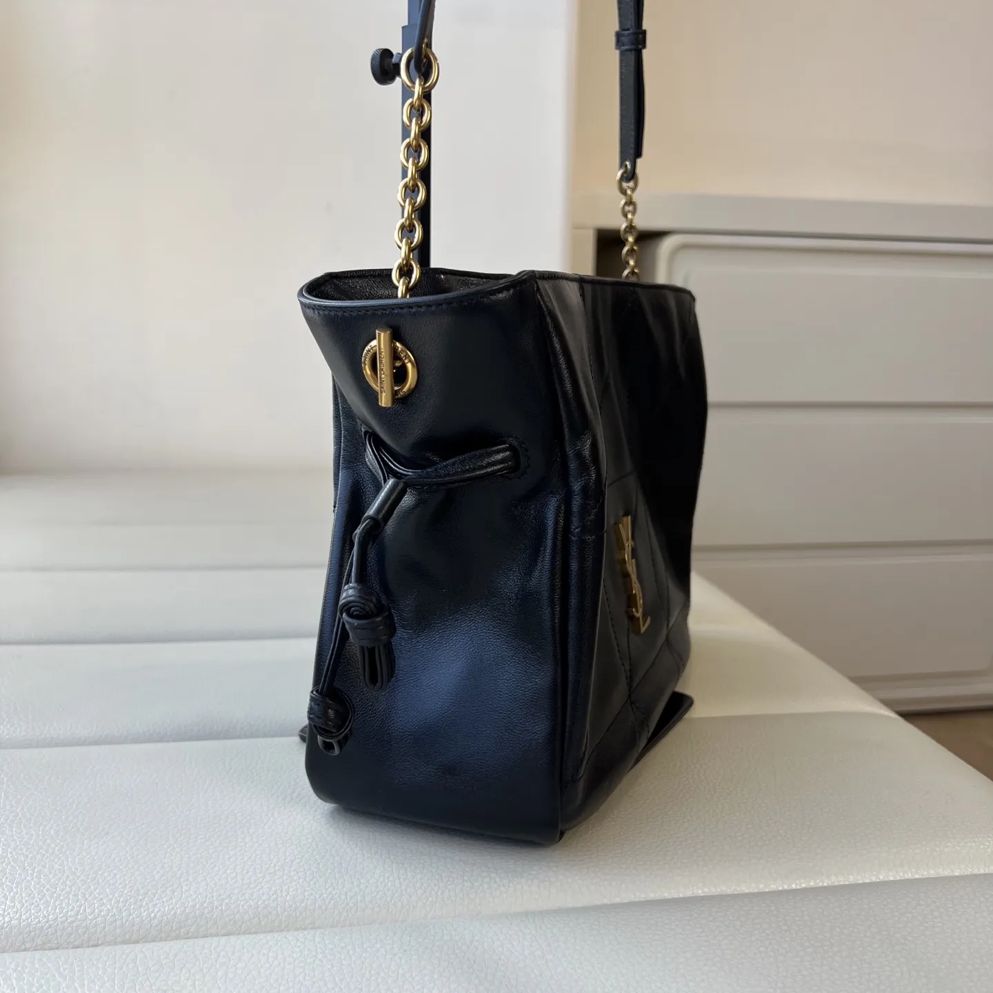 YSL 1:1 premium June Hobo bag in black quilted lambskin featuring gold-tone pivoting monogram closure and chain shoulder strap - xiashuluxe