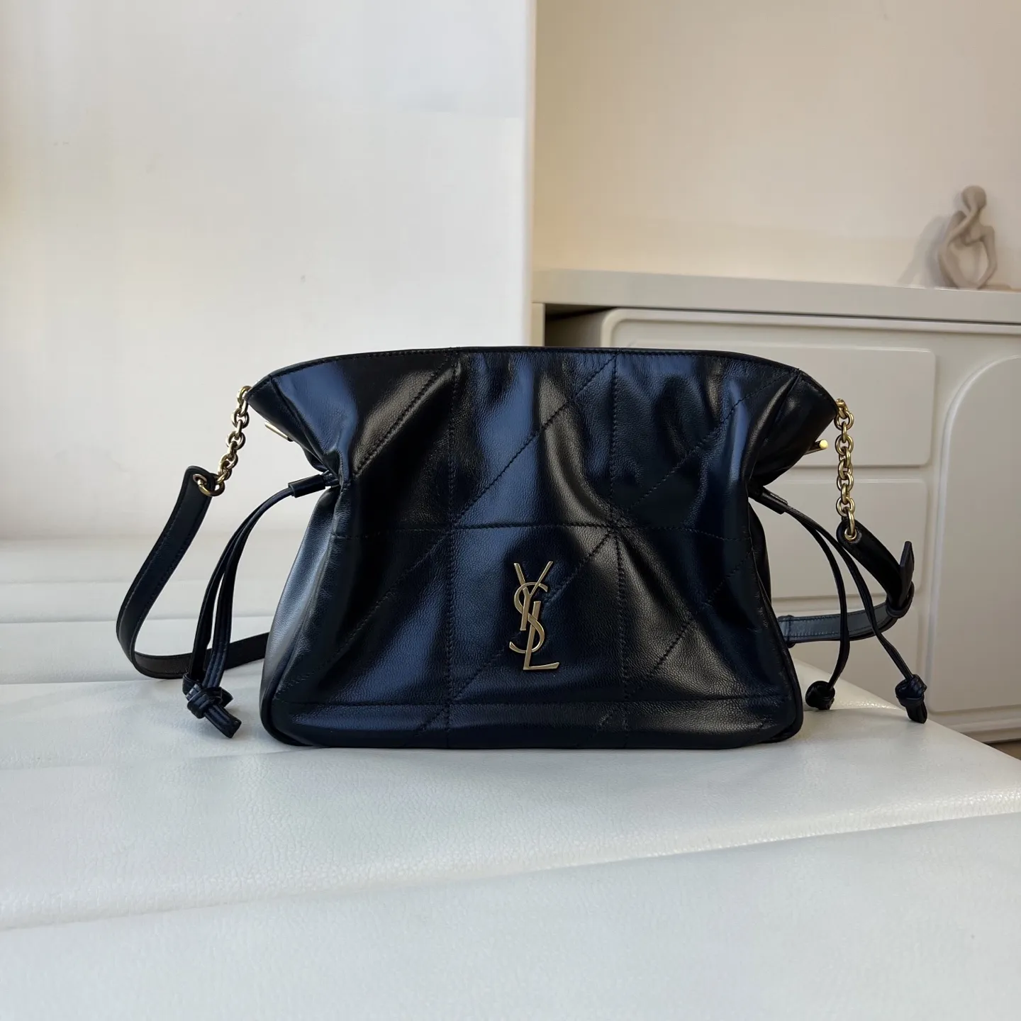 YSL 1:1 premium June Hobo bag in black quilted lambskin featuring gold-tone pivoting monogram closure and chain shoulder strap - xiashuluxe