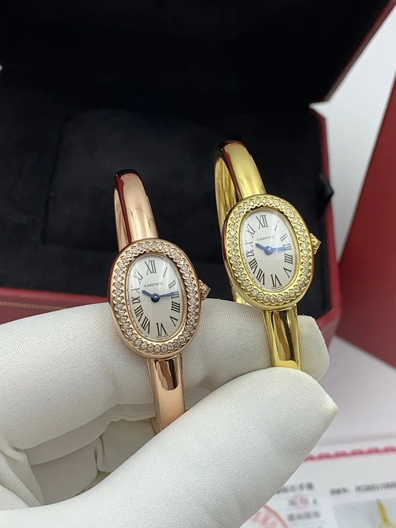 Cartier 1:1 premium Baignoire bangle watch in 18K rose gold and yellow gold with diamond-set oval bezel on display - xiashuluxe