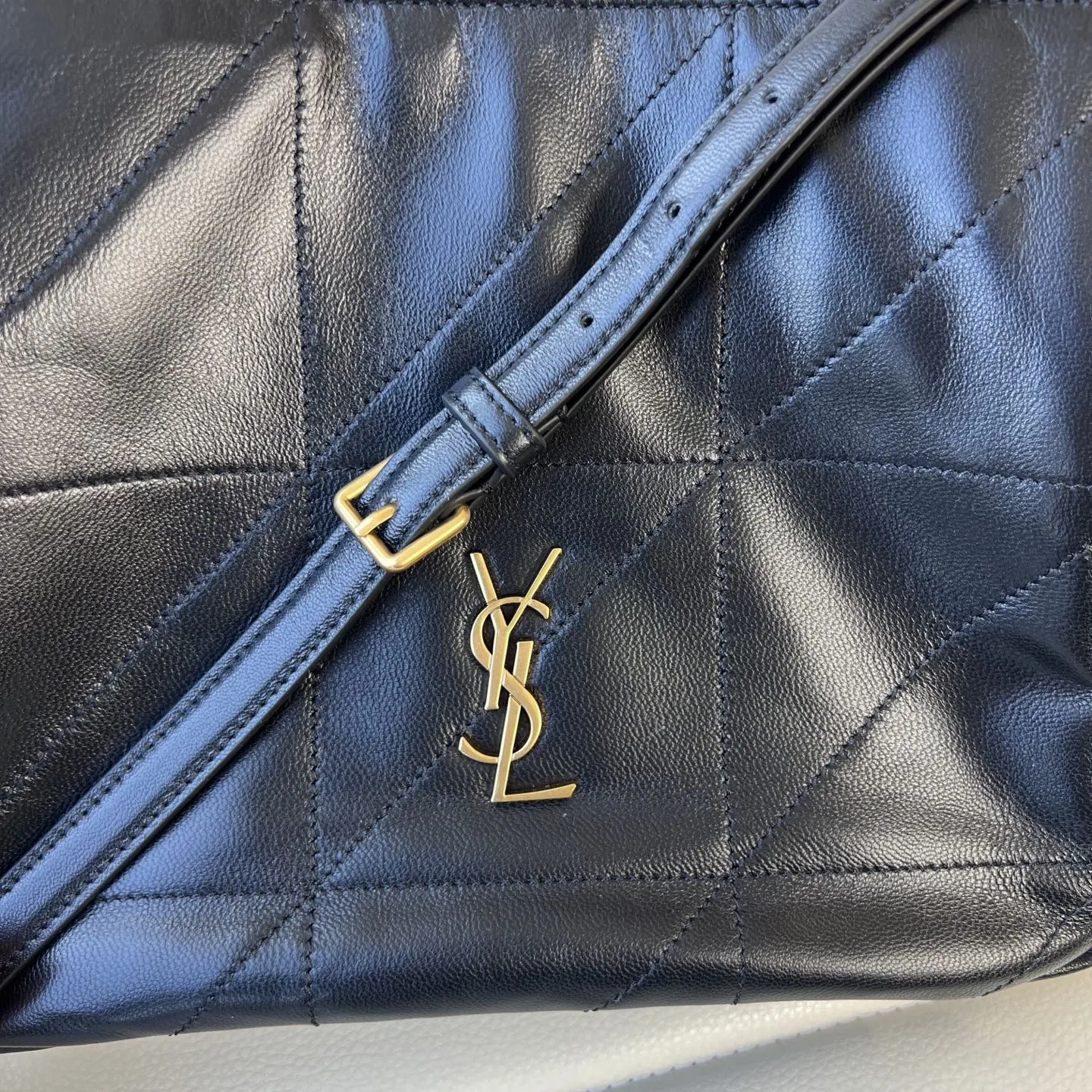 YSL 1:1 premium June Hobo bag in black quilted lambskin featuring gold-tone pivoting monogram closure and chain shoulder strap - xiashuluxe