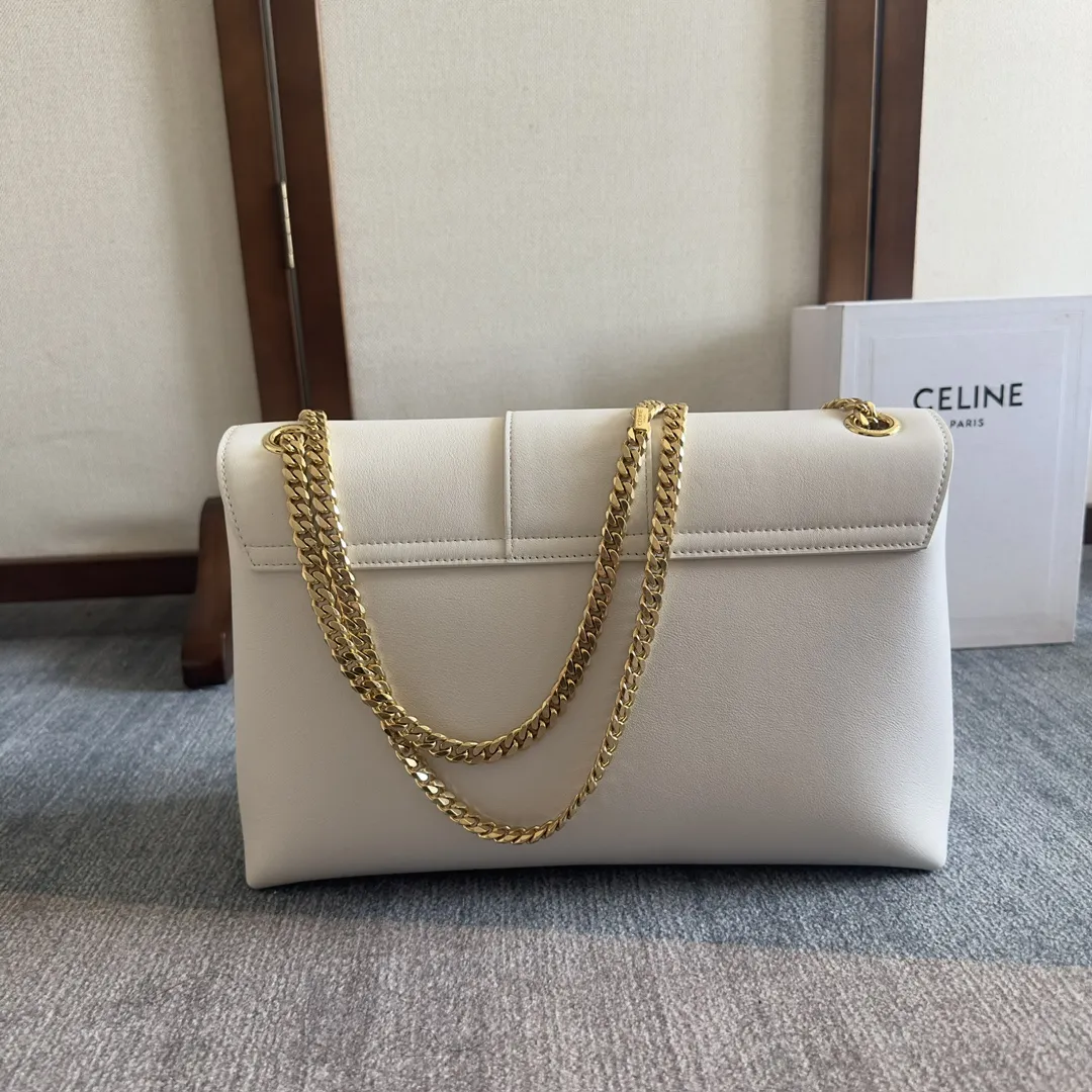 Front view of CELINE Medium Victoire Bag in white supple calfskin with gold Triomphe clasp and sliding chain strap