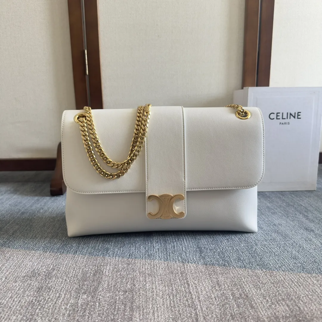 Front view of CELINE Medium Victoire Bag in white supple calfskin with gold Triomphe clasp and sliding chain strap