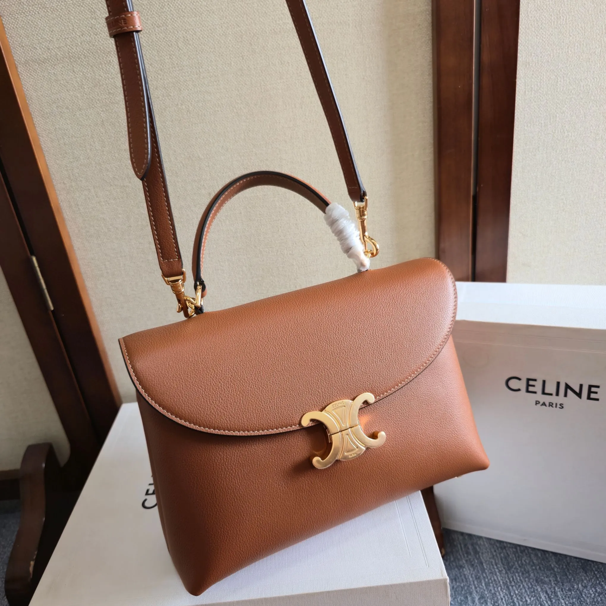 Celine 1:1 premium Teen Besace Triomphe bag in Tan polished calfskin with gold-tone Triomphe metallic closure and boutique packaging - xiashuluxe