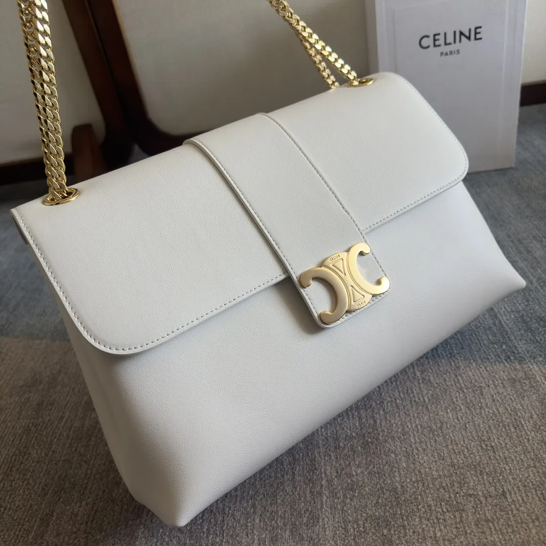 Front view of CELINE Medium Victoire Bag in white supple calfskin with gold Triomphe clasp and sliding chain strap