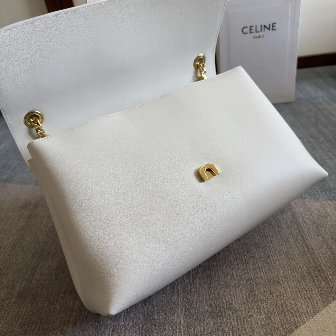 Front view of CELINE Medium Victoire Bag in white supple calfskin with gold Triomphe clasp and sliding chain strap