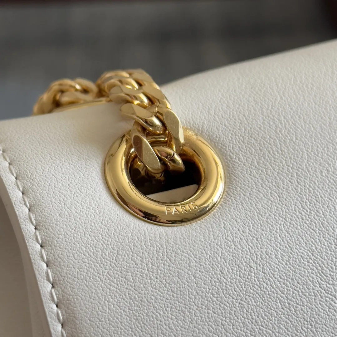 Front view of CELINE Medium Victoire Bag in white supple calfskin with gold Triomphe clasp and sliding chain strap