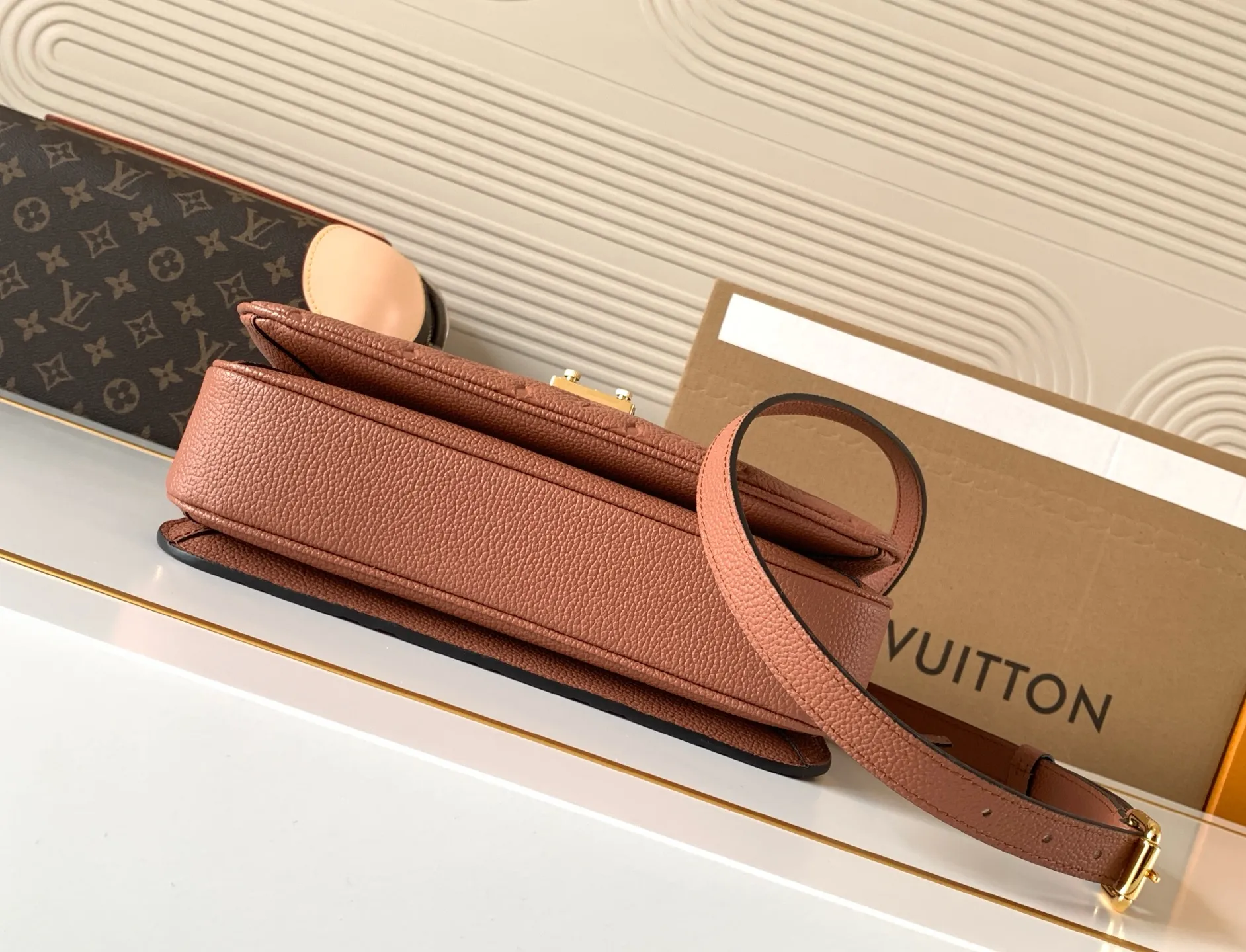 Internal view of LV Metis bag with three distinct compartments and neat fabric lining