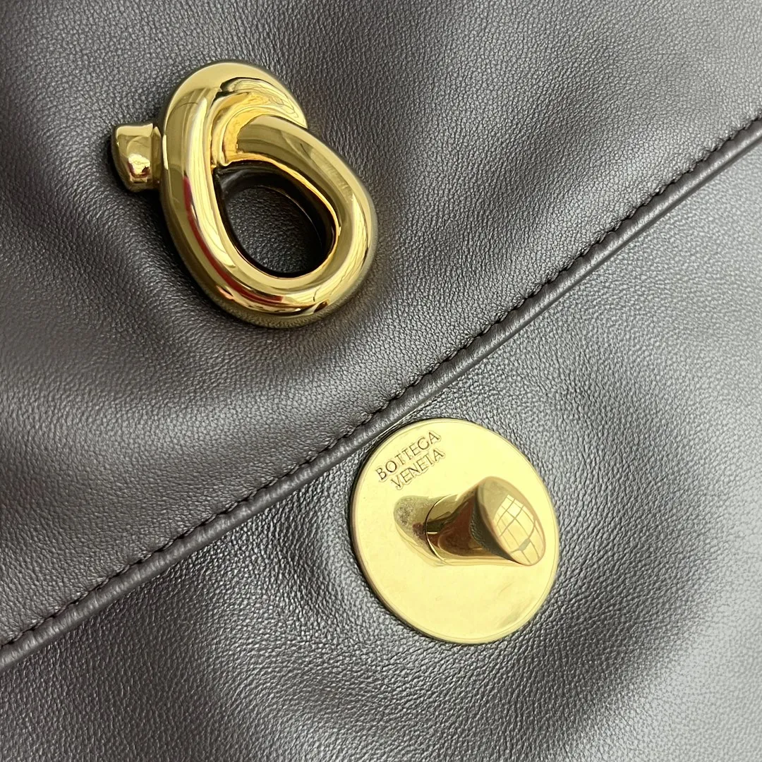 Handheld view of BV Madison bag showing its flexible shape