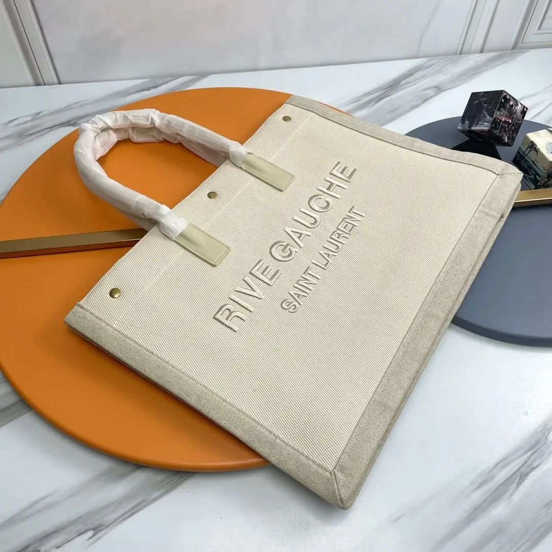 横款💰💰470_ Rive Gauche Tote Bag，左岸购物袋🛍️，从定制麻布料到五金在到丝印，每一个细节我都要求完美！zp购入开模定制，说真的，这是我遇到过最难做的一款购物袋了！托料极其复杂，经过反复试验才做到跟zp完全一样的手感！旅游出差必备时尚款！p 型号：509415.Zx 48x36x16cm：48x36x16cm